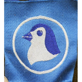 insigne tissu inconnu tête de pingouin sur fond bleu et cercle blanc
