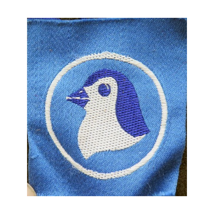insigne tissu inconnu tête de pingouin sur fond bleu et cercle blanc