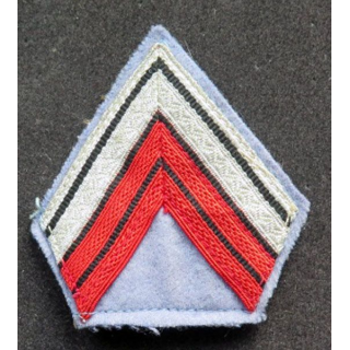 Galon de caporal  chef ADL rouge et argent sur tissu bleu clair avec crochets
