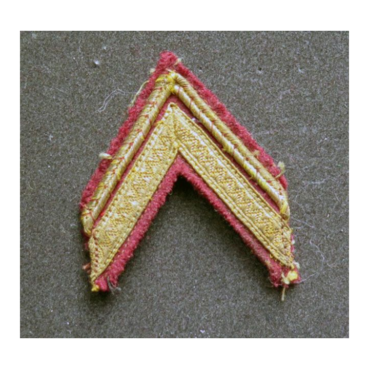 Galon de sergent ADL sur tissu marron