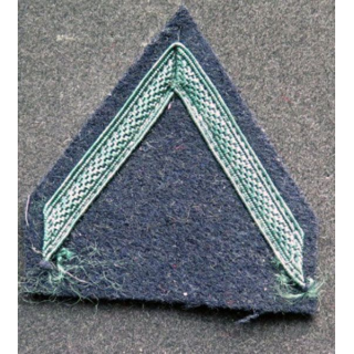 Galon vert foncé de soldat de 1° classe sur tissu bleu noir légion