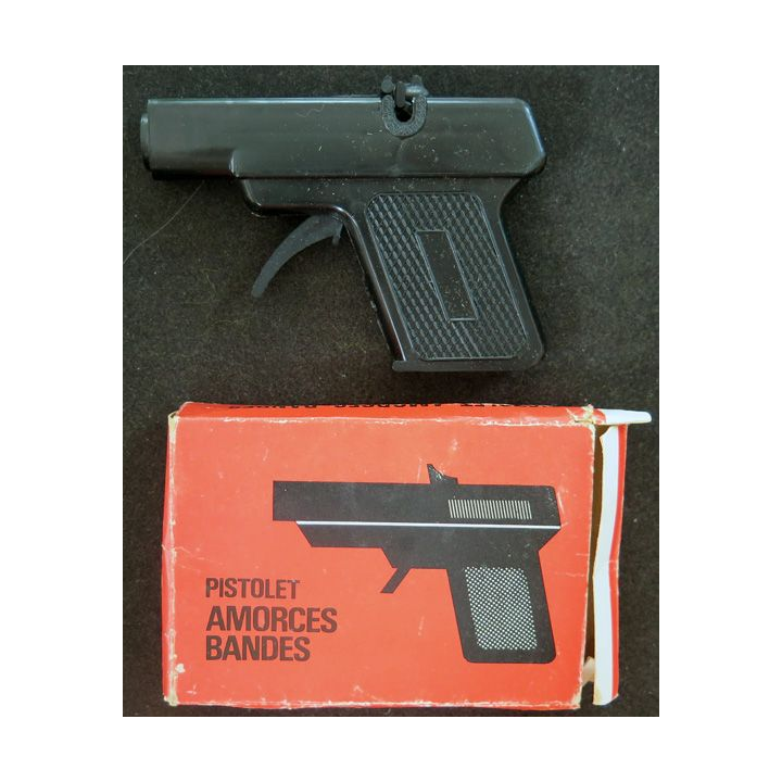 Pistolet amorces bandes dans sa boite