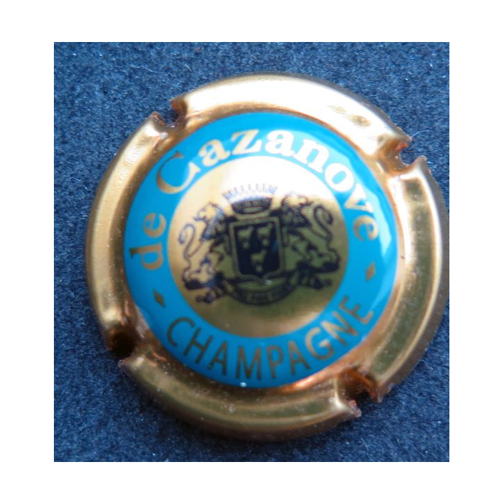 Capsule Muselet de bouteille de champagne De CAZANOVE n° 19a cercle iet contour or foncé "C" ouvert