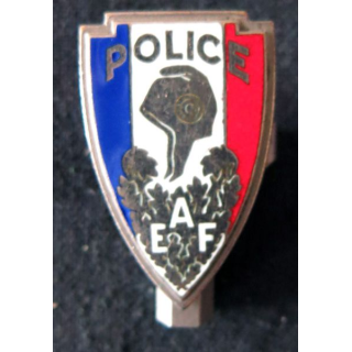POLICE : insigne métallique de coiffure de la Police nationale AEF de fabrication Fraisse en émail