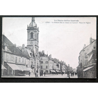Carte postale Lure (Haute Saône) n° 1 La Grande Rue en venant de Luxeuil Place de l'Eglise