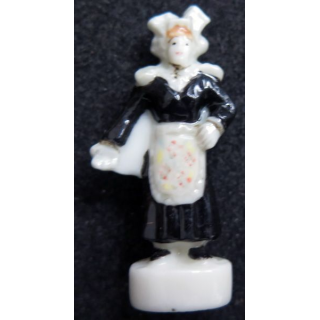 fève femme à la robe noire en céramique