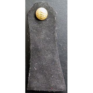 Vieille épaulette du service de santé avec bouton