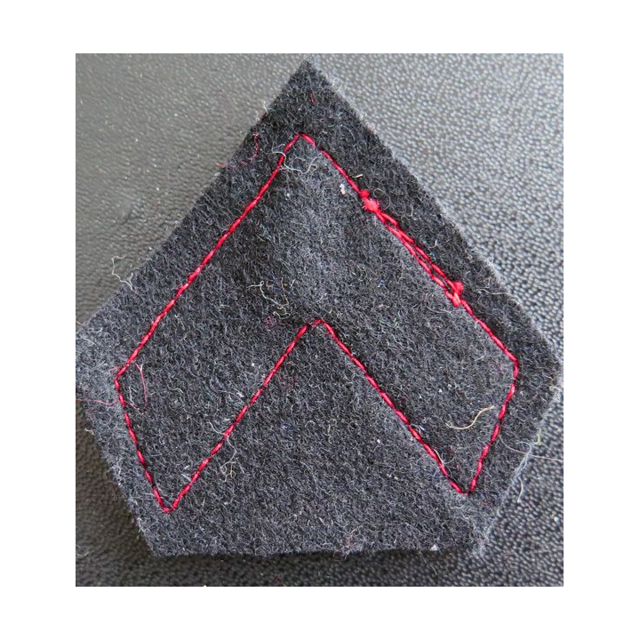 Galon de caporal sur tissu bleu noir