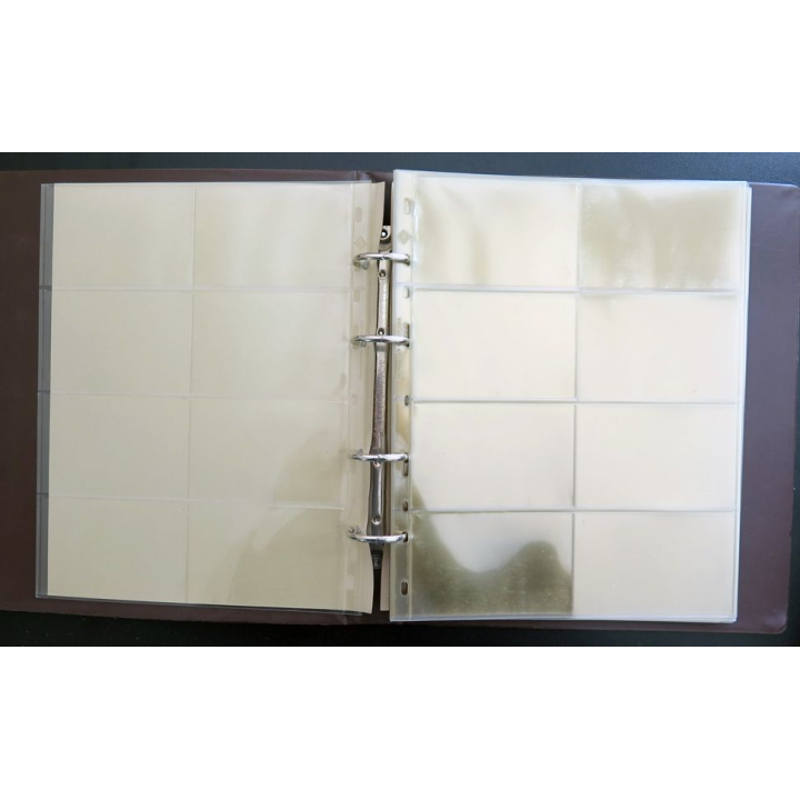 Classeur marron comprenant 29 feuilles transparentes pouvant contenir 8 cartes téléphoniques