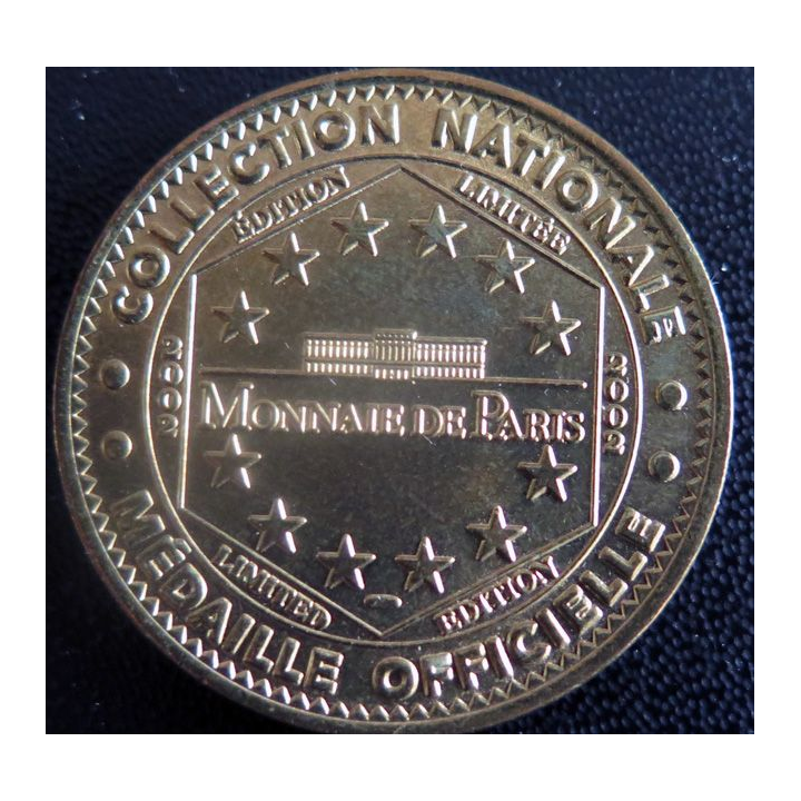 Médaille souvenir en métal doré de Vulcania diamètre 3,4 cm