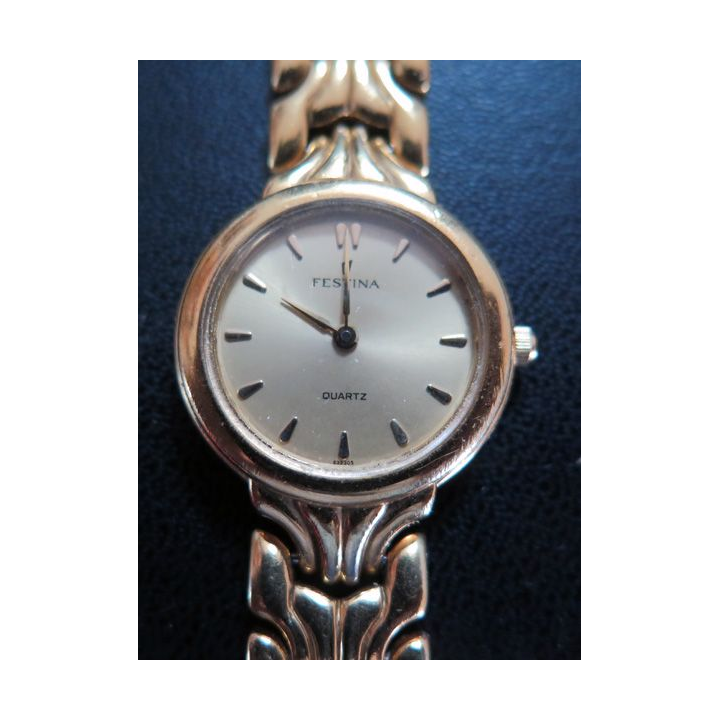 Montre Vintage femme FESTINA en métal doré (plaqué or ?)