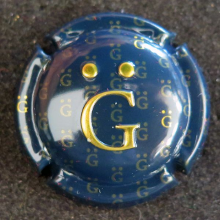 Capsule Muselet de bouteille de champagne GIRAUD Henri n° 18 estampée bleu noir et or