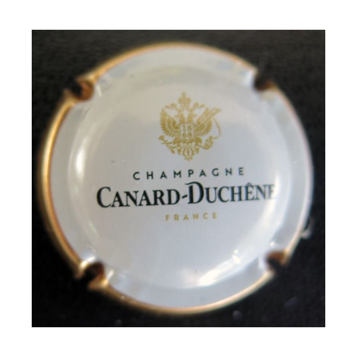 Capsule Muselet de bouteille de champagne CANARD-DUCHENE n° 77h blanc contour or
