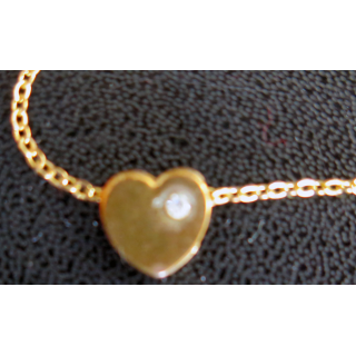 Chaine en métal doré avec coeur et brillant longueur 40 cm largeur du coeur 1 cm