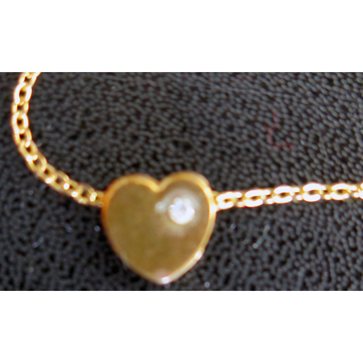 Chaine en métal doré avec coeur et brillant longueur 40 cm largeur du coeur 1 cm