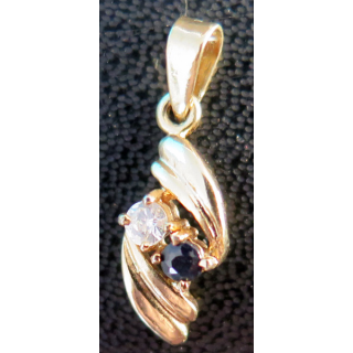 if avec pierres synthétiques (brillant et noire) en métal doré (Plaqué or ?) hauteur 2 cm