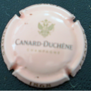 Capsule Muselet de bouteille de champagne CANARD-DUCHENE n° 81c Rose pâle, noir et or