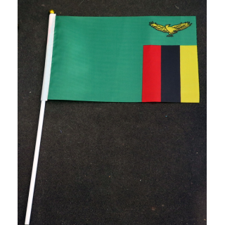 Petit drapeau à main de la Zambie fixé sur une hampe en plastique blanc 20 x 13,5 cm