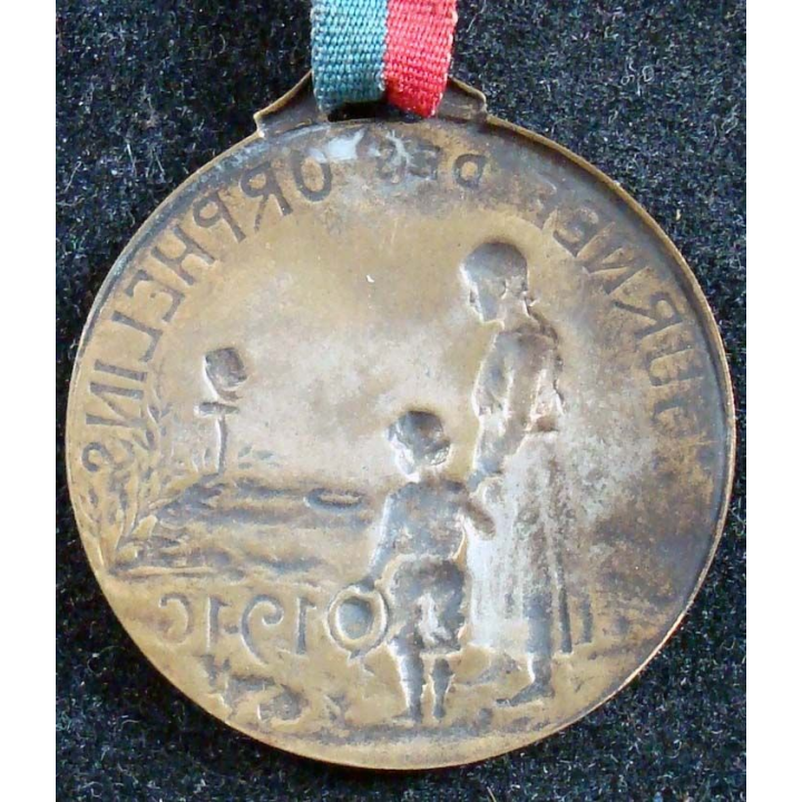 JOURNEE 1914 - 1918  :  médaille en métal embouti de la journée des orphelins 1916