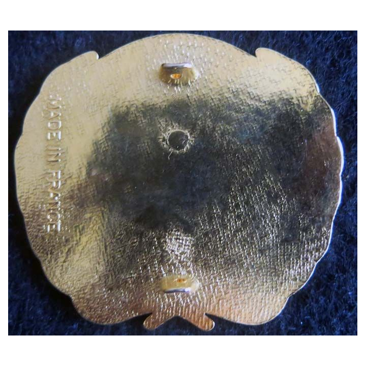 insigne métallique de béret plat de l'ONU