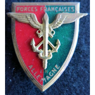 FFA : Insigne métallique des forces françaises en Allemagne de fabrication Drago G. 803 applique collée
