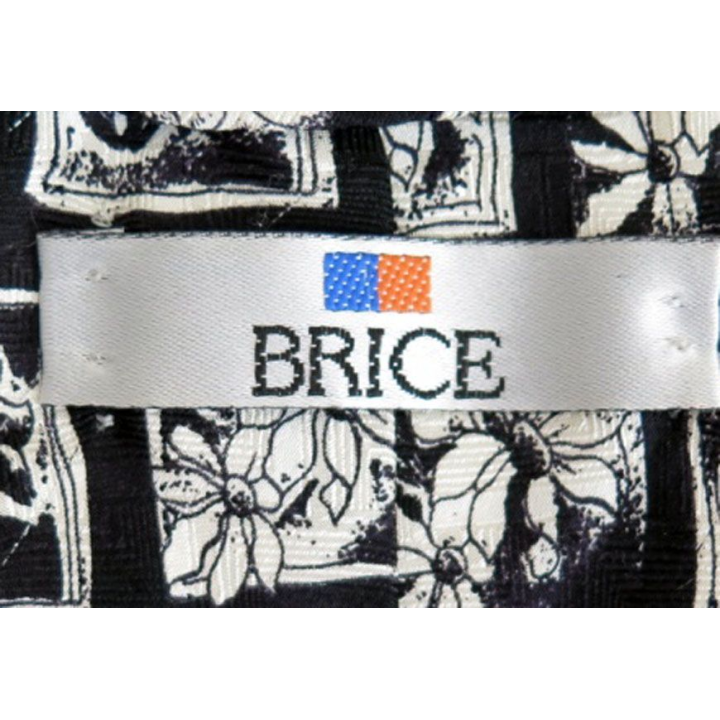 Cravate Brice 100 % soie à dominante noire avec fleurs blanches