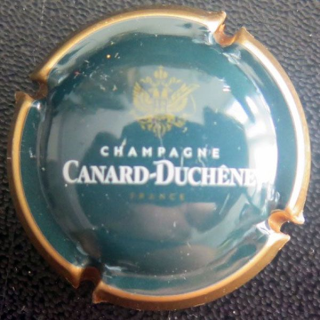 Capsule Muselet de champagne CANARD DUCHENE n° 77e vert foncé, contour or