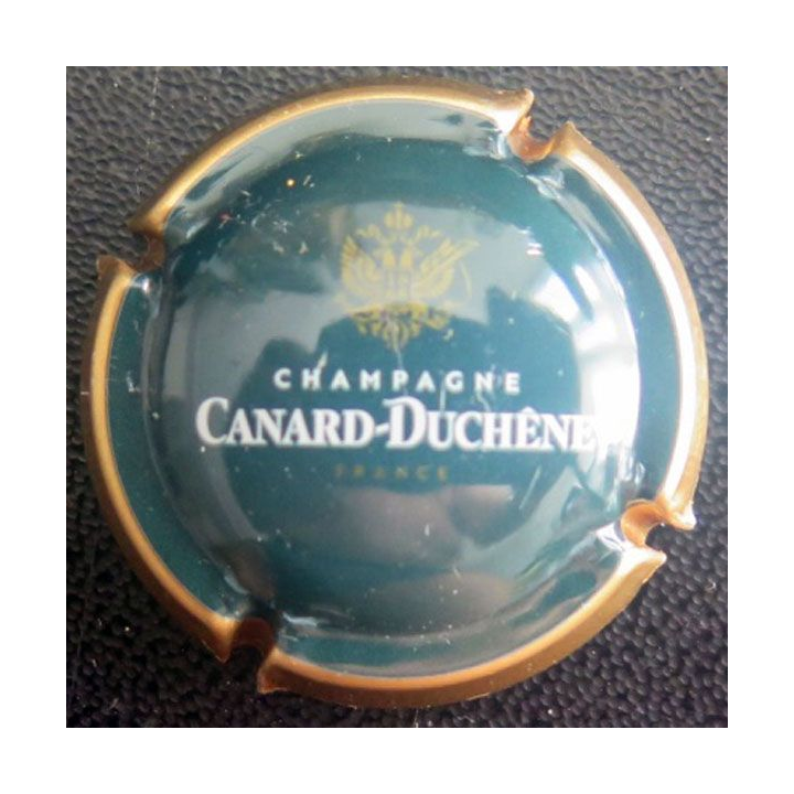 Capsule Muselet de champagne CANARD DUCHENE n° 77e vert foncé, contour or
