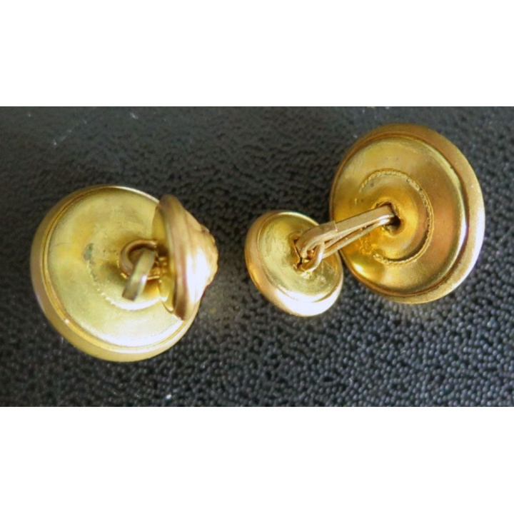 bouton de manchettes du génie à base de boutons