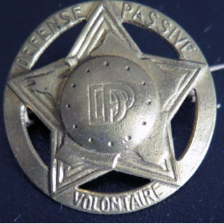 Insigne des volontaires de la défense passive en laiton