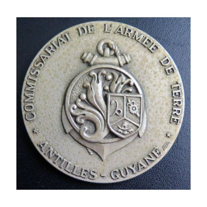 CAT : plaque du commissariat Antilles Guyane en métal argenté de diamètre 74 mm
