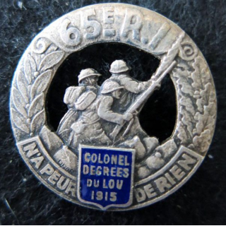 65° RI : insigne métallique du 65° régiment d'infanterie de fabrication Drago Paris Beranger en émail